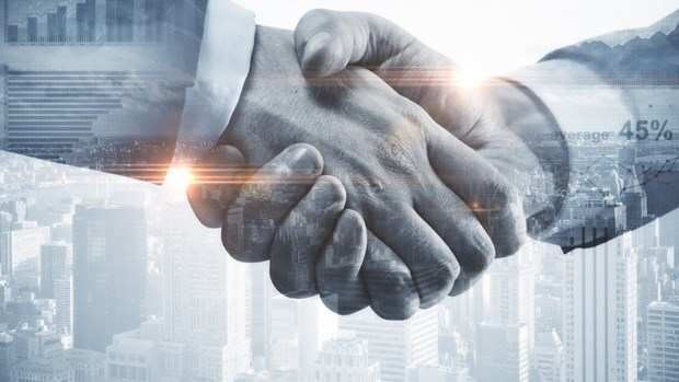 Normal 1569062595 Close Up Of Handshake On City Background 679955418
