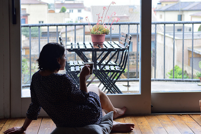 A 3-Part Plan for Presenting Real Estate as an Investment to Your Spouse sad woman sitting and looking out the window