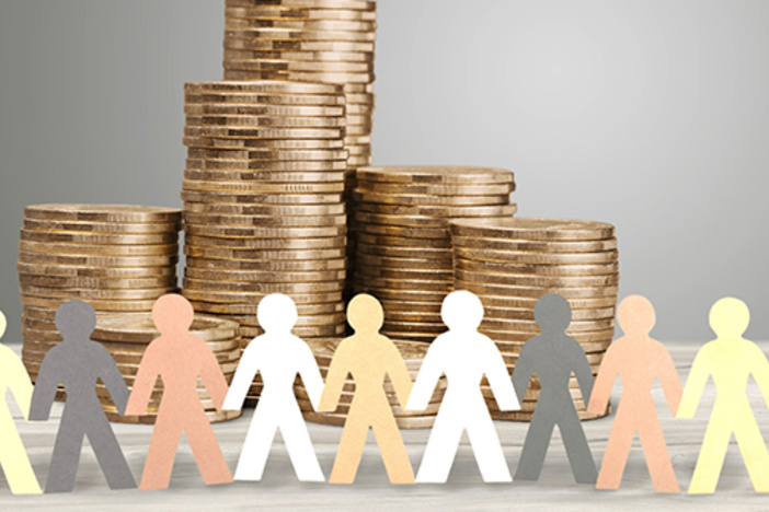 This Couple Raised $10MM in One Week. Here’s How (& Why) They Did It paper cutouts of people on multicolored paper positioned in front of several stacks of coins against a gray background