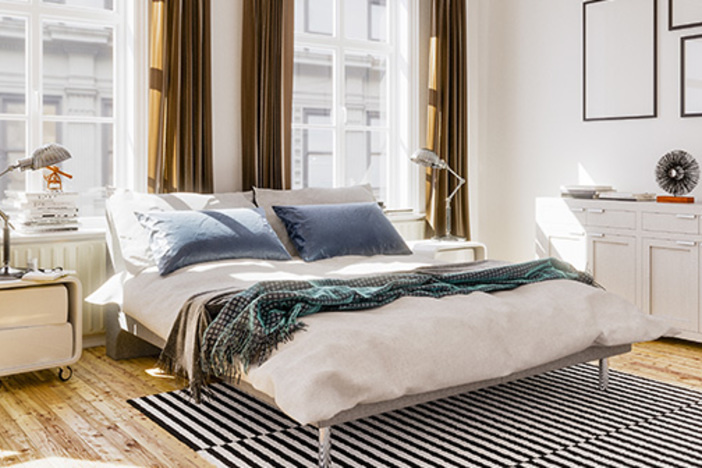 How to Improve Your Ranking in Airbnb Search Results nicely decorated bedroom with big windows and open curtains