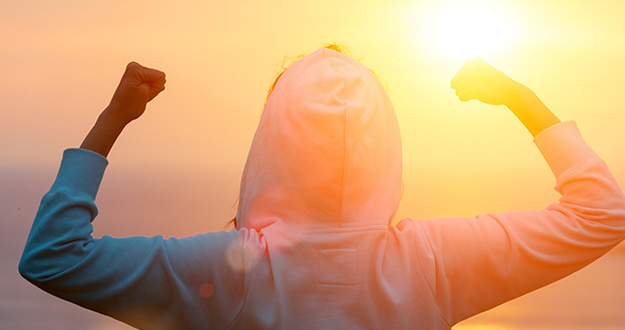 House Hack No. 2: Guess How Much I’ve Added to My Net Worth?! Back view of strong motivated woman celebrating workout goals towards the sun. Morning healthy training success.