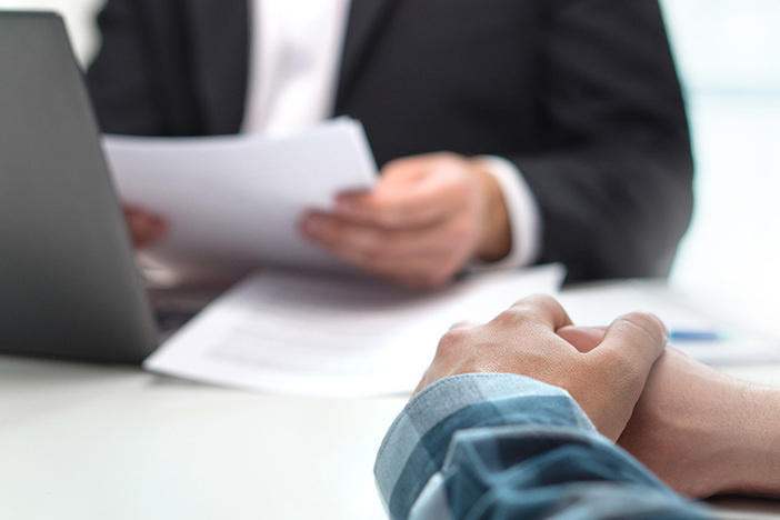 Changes to Due-on-Sale Clause Silently Enacted by Fannie Mae: A Win for Investors People having meeting in office. Boss with a job applicant in in