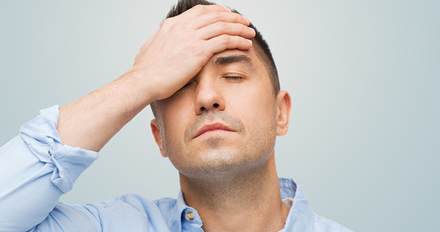 How I Broke the Law to Protect My Real Estate Investment unhappy man with closed eyes touching his forehead
