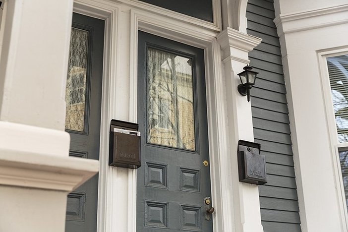 Real Estate Ride Along: Buying, Renovating, & Selling a 6-Unit Multifamily Property Front door, gray with white trim with pillars