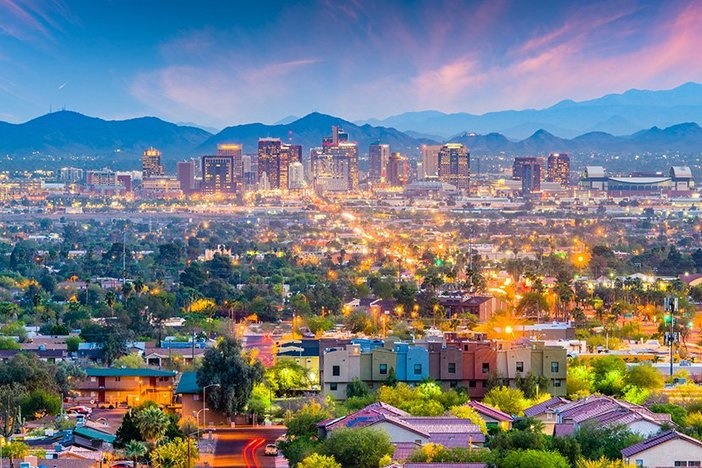 7 Metros With the Biggest Rent Growth Over the Last 5 Years Phoenix, Arizona, USA downtown cityscape at dusk.