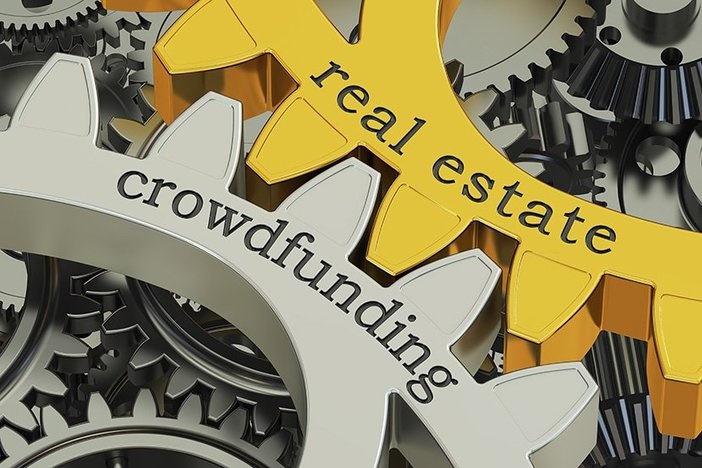 SEC Approves Changes to Crowdfunding Laws real estate crowdfunding concept on gearwheels