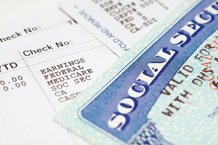 How Social Security Works If You’re Self-Employed Social security cards with statements.