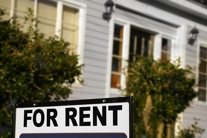 The Definitive Guide To Tenant Screening House with "For Rent" sign in front