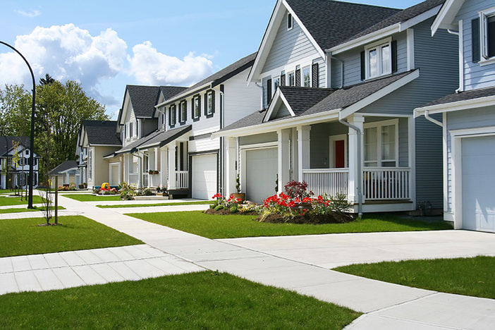 Property Lien Search: How to Find Out About a Lien on Property medium to large sized homes on neighborhood street with well manicured lawns
