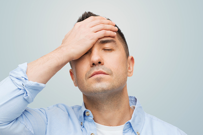 5 Compelling Reasons You Should Think Twice Before Wholesaling Properties unhappy man with closed eyes touching his forehead