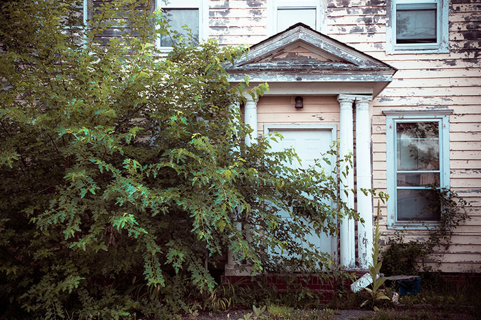 6 Ways to Locate Distressed Properties Online Exterior facade on abandoned foreclosed home