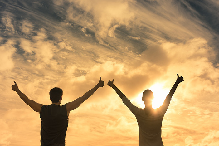The Fair Housing Act and Landlords: What You Should Know Man and woman feeling happy, and positive facing sunset sky