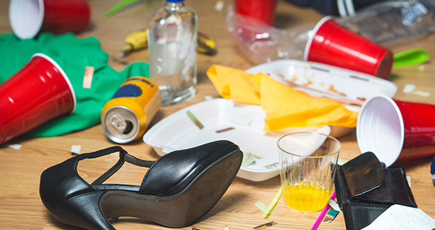 5 Ways to Deal With a Tenant Owing You More Than Their Deposit Will Cover Terrible mess after party. Trash, bottles, food, cups and clothes on floor.